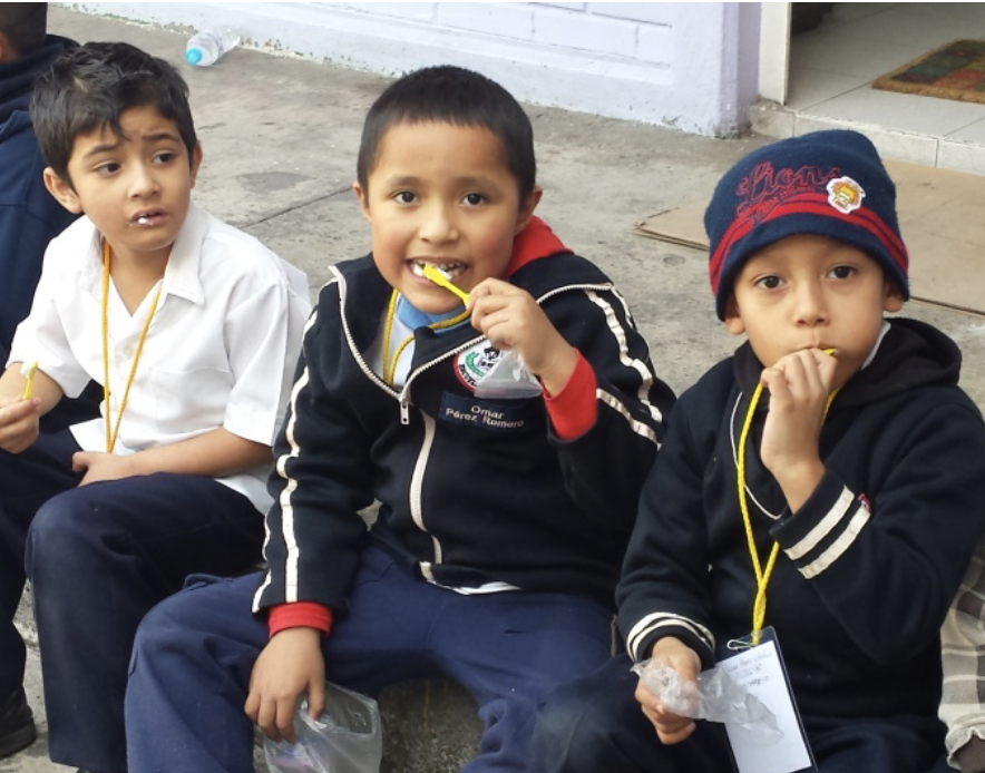 Children in Mexico brushing their teeth